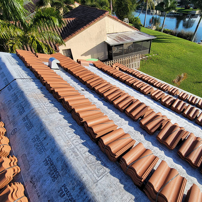 Barrel Tile Reroof in Delray Beach, Florida. In-process project using Boral product Estate Terra Cota concrete tiles.