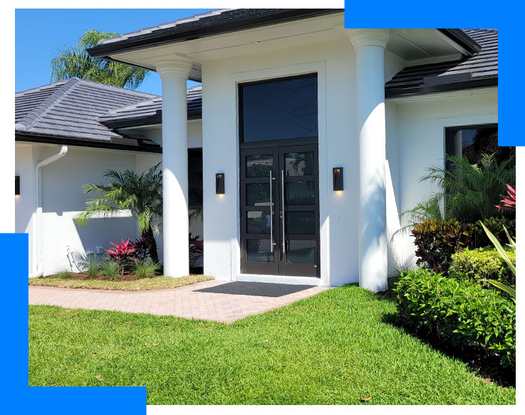 Photo of an exterior glass impact door on a residential home in Florida installed by MIW Roofing & Windows